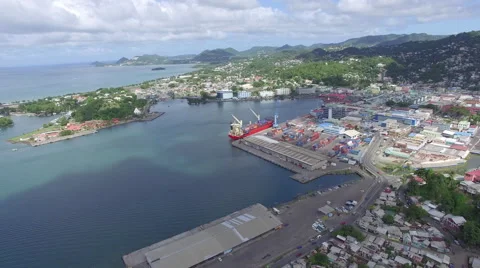 Backwards tracking of a Caribbean town - Drone footage Stock Footage 63455249