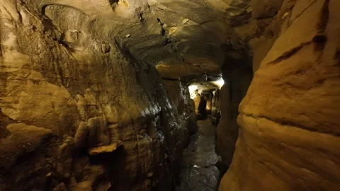 Backwards Walk Through a Winding Underground Cavern in a Cave Stock-Footage 332305246