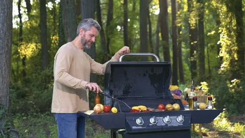 Backyard barbeque with chill. Weekend barbeque cooking. Outdoor barbeque moment Stock Footage 328954603
