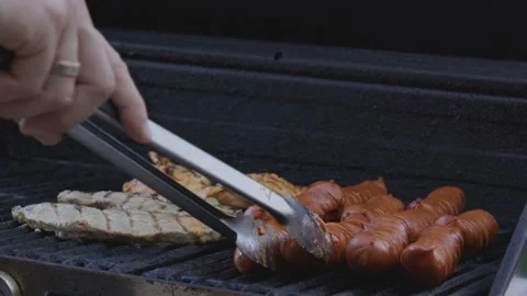 Backyard BBQ. Man cook steak meat, slow motion. Man with barbeque roast meat Stock Footage 341035849
