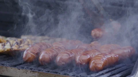 Backyard BBQ. Man cook steak meat, slow motion. Man with barbeque roast meat Stock Footage 345505327