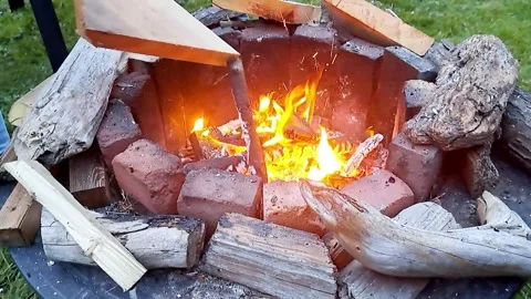 Backyard bonfire in a firepit Stock Footage 272549932