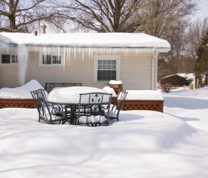 Backyard Deck in Winter Deep Snow and Icicles Stock Photos