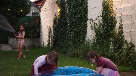 Backyard fun with inflatable pool and water games Stock Footage 316482813