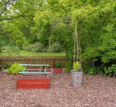 Backyard garden with picnic table and raised beds Stock Photos
