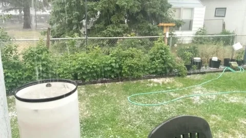 Backyard heavy rainfall and hail Stock Footage 168911768