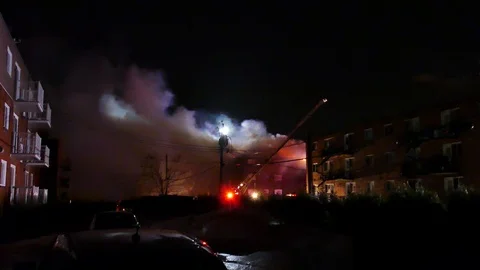Backyard of heavy structure fire Stock Footage 105280300
