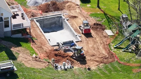 Backyard pool construction at residential home in America, United States, USA Stock Footage 334605425
