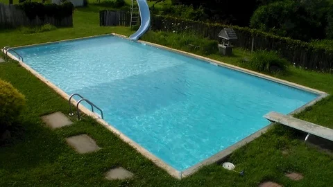 Backyard Pool Water Summer Grass Daytime Teal Colors Stock Footage