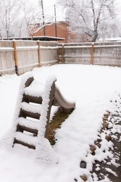 Backyard slide after blizzard Stock Photos