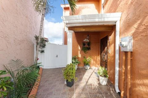 Backyard Surrounded by large vegetation short grass, stone paths Stock Photos