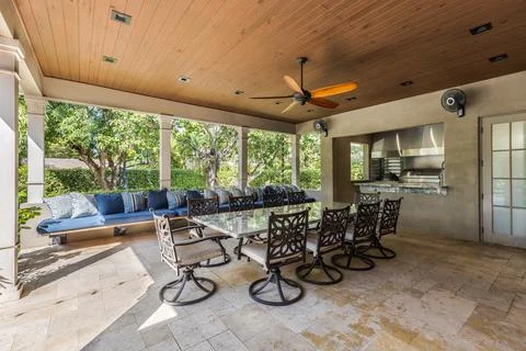 Backyard Surrounded by large vegetation short grass, stone paths Stock Photos