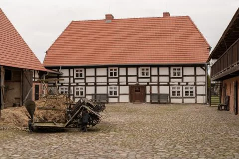 A backyard of a traditional farm. The old method of construction in the count Stock Photos
