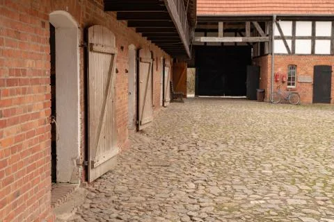A backyard of a traditional farm. The old method of construction in the count Stock Photos