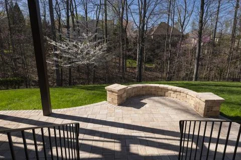 Backyard View with Concrete Pavers in the Spring Stock Photos