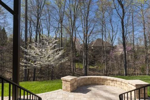 Backyard View with Concrete Pavers in the Spring Stock Photos