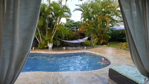 Backyard Walk Around Pool To Hammock Stock Footage 96225251