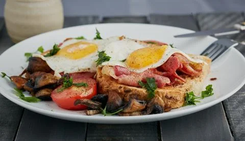 Baco and egg on toast. Stock Photos