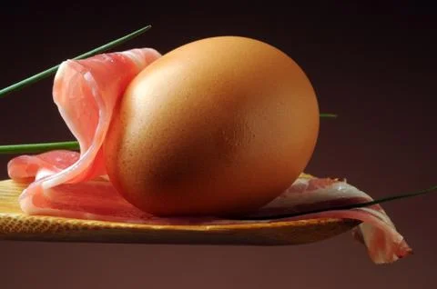 Bacon and egg on spoon Stock Photos