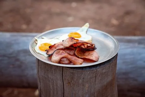 Bacon And Eggs Breakfast Served From A Bush Campfire Stock Photos