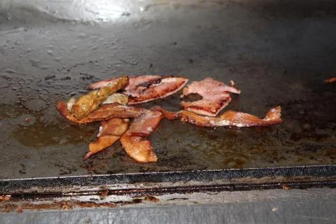 Bacon and Ham on Flat Top Grill Stock Photos