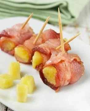 Bacon and pineapple appetizer Stock Photos