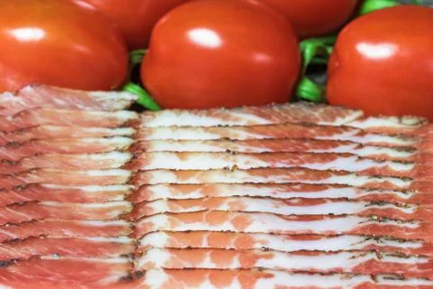 Bacon and tomatoes closeup Stock Photos