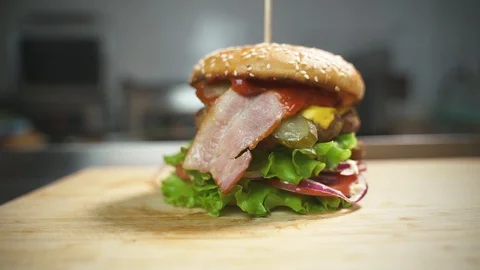Bacon and vegetables burger Stock Footage 129685184