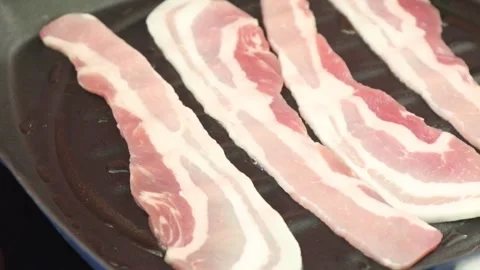Bacon Being Cooked in A Griddle Pan Stock Footage 244738922