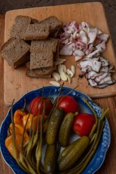 Bacon, bread and cucumber over wooden background. Russian and ukrainian tradi Stock Photos