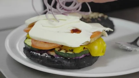  Bacon burger with beef patty on red wooden table 스톡 동영상 104103537