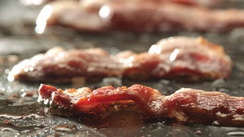 Bacon cooking on griddle Stock Footage 120459893