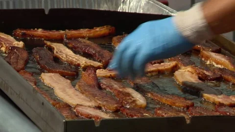 Bacon cooking on grill Stock Footage 163482320