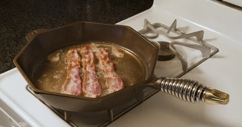 Bacon Cooking Time Lapse Forwards and Backwards Stock Footage 106721122