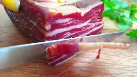 Bacon cut with a knife slow motion Stock Footage 113268517