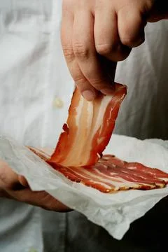 Bacon on a dark rustic background Stock Photos