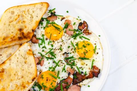 Bacon, eggs and chive with crispy toast Stock Photos