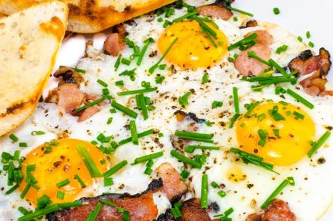 Bacon, eggs and chive with crispy toast Stock Photos