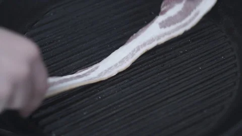 Bacon is fried in a pan Stock Footage 106631752