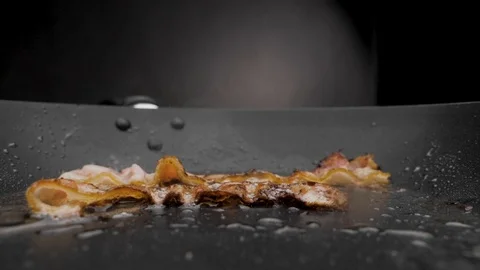 The bacon is fried in a pan. Stock-Footage 117037549