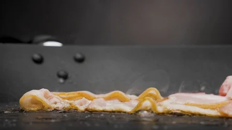 The bacon is fried in a pan. Stock Footage 117517613
