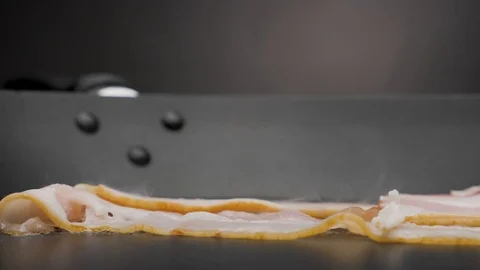The bacon is fried in a pan. Stock Footage 118470556