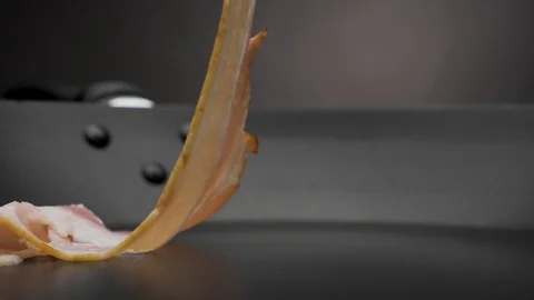 The bacon is fried in a pan. Stock Footage 119453469