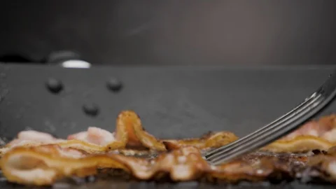 The bacon is fried in a pan. Stock-Footage 119453503