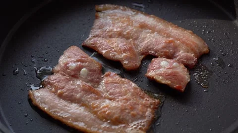 Bacon fried in a pan Stock Footage 134605876
