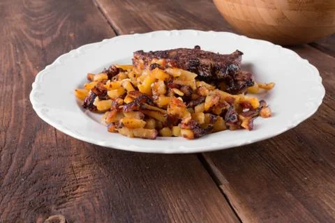 Bacon with fried potatoes Stock Photos