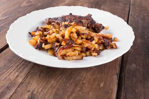 Bacon with fried potatoes Stock Photos