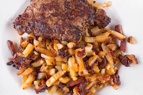 Bacon with fried potatoes Stock Photos