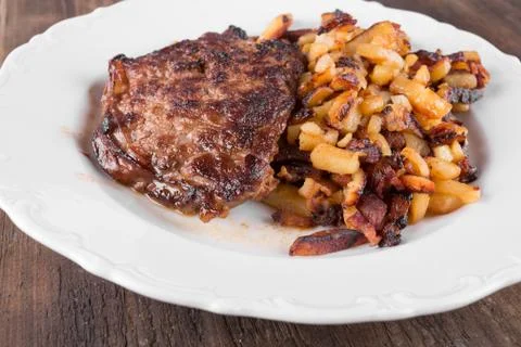 Bacon with fried potatoes Stock Photos
