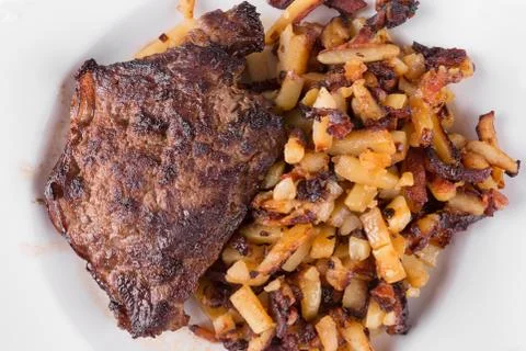 Bacon with fried potatoes Stock Photos